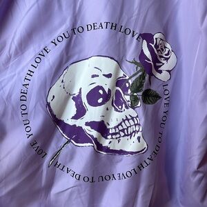 Lilac, light purple, hooded windbreaker, with skull graphic